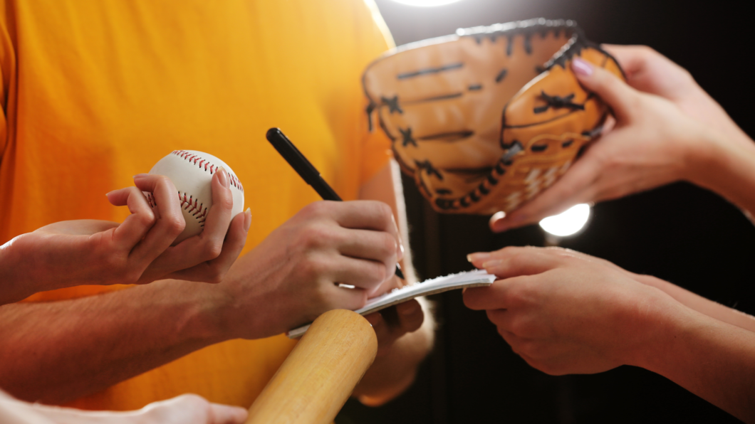 How does being a pro athlete affect your mental health | stock photo of pro baseball player signing autographs
