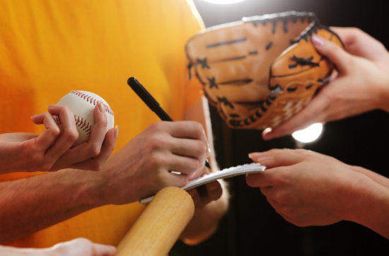 How does being a pro athlete affect your mental health | stock photo of pro baseball player signing autographs