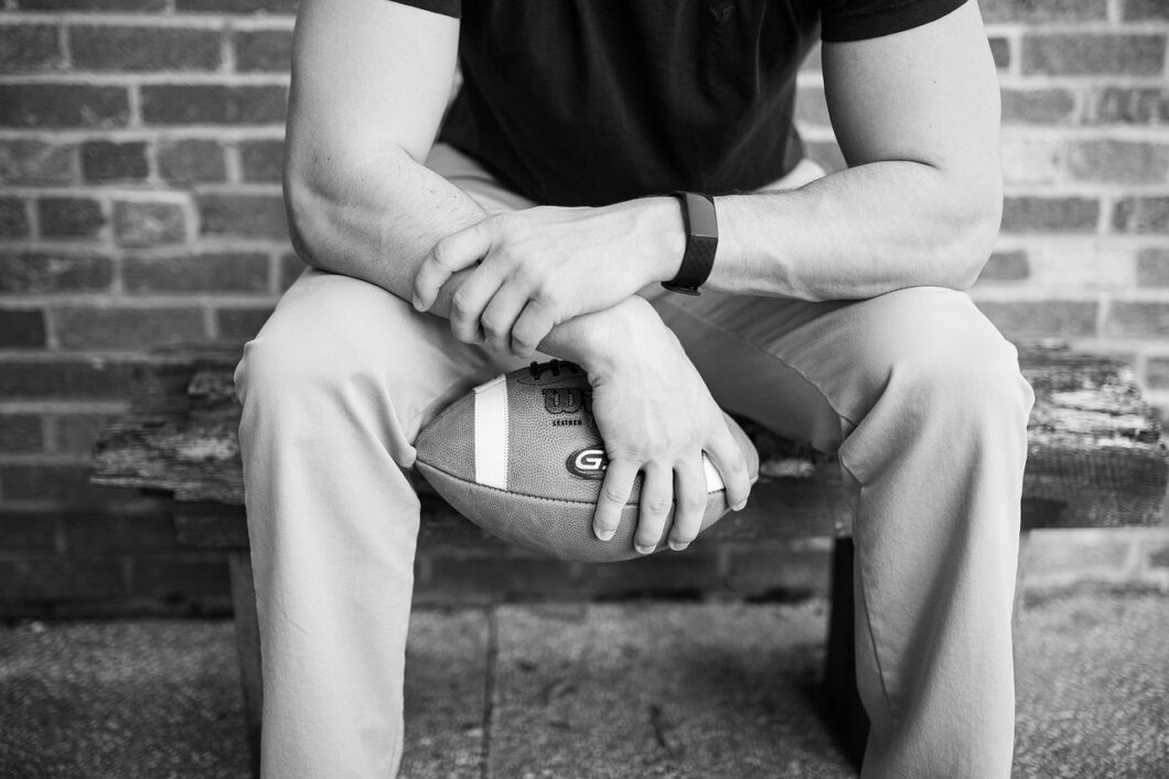 Spotlight on Male Athlete Mental Health During National Men's Health Awareness Month | Male holding a football