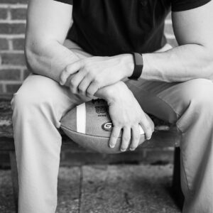 Spotlight on Male Athlete Mental Health During National Men's Health Awareness Month | Male holding a football