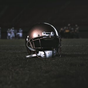 Jayden Daniels Shares Mindfulness and Winning Mindset Secrets | Photo of football helmet on field | Photo by: Photo by Lucas Andrade on Pexels