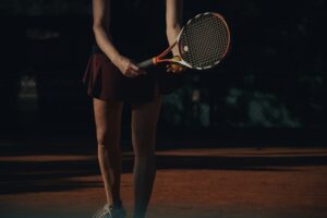 The Secret Scale Elite Athletes Use to Get in the Zone tips | woman holding a tennis racket